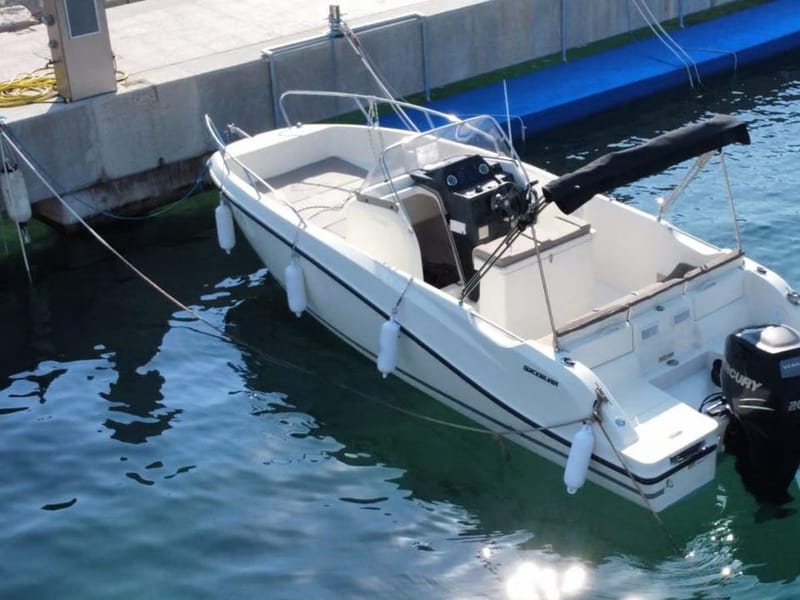 Quicksilver 675 speedboat rental in Dubrovnik — 6.75 m open boat with bimini and side curtains at Marina Frapa
