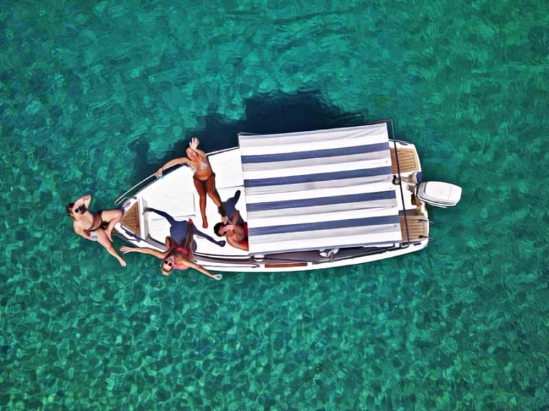 Private Elaphiti Islands boat tour from Dubrovnik — speedboat moored off Šunj sandy beach on Lopud