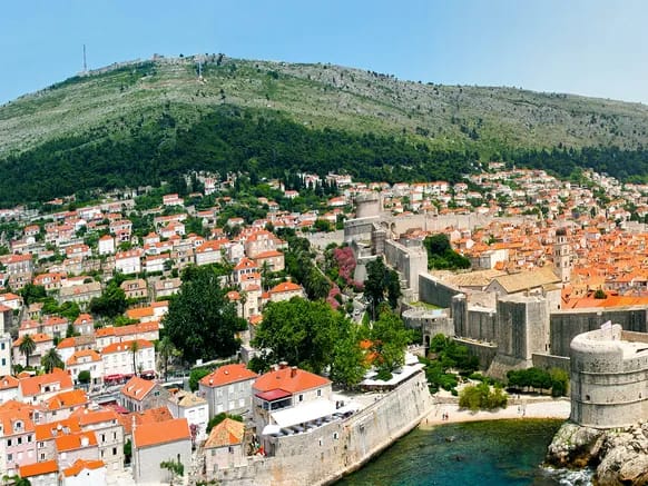 Dubrovnik panorama group boat tour — Old Town walls and Lokrum seen from the sea
